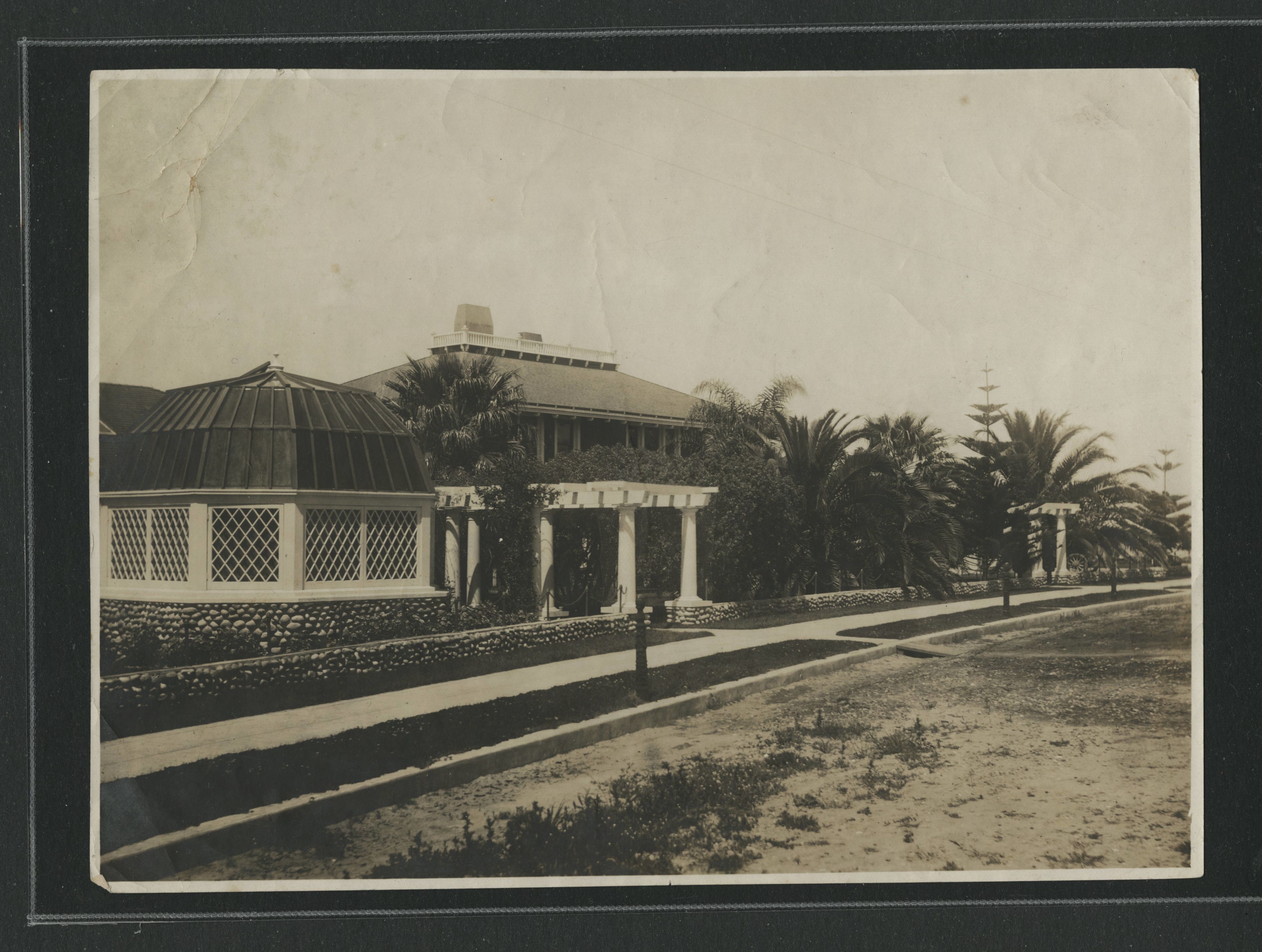 The front view of a house and street in La Jolla.