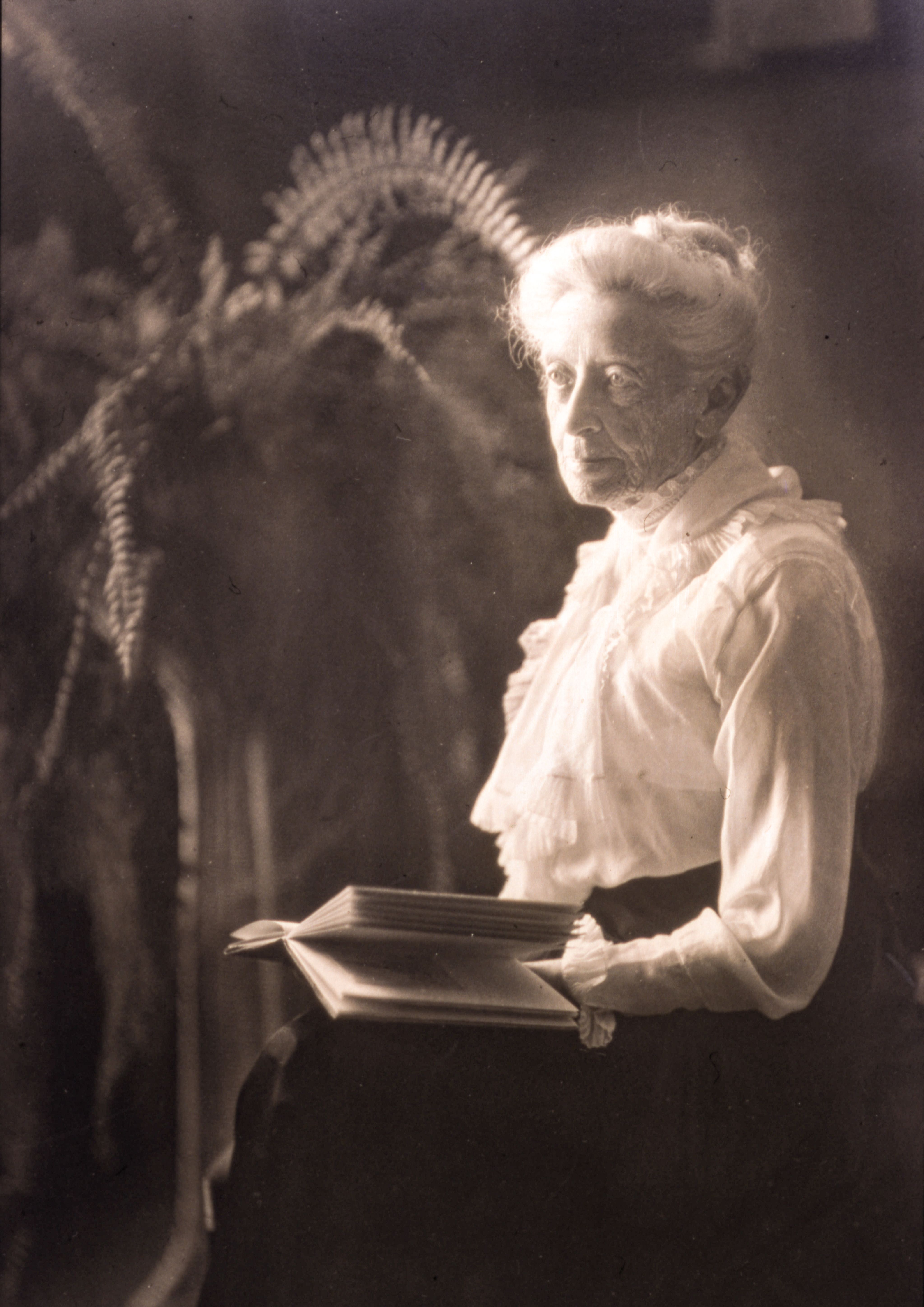 Ellen Browning Scripps with an open book.