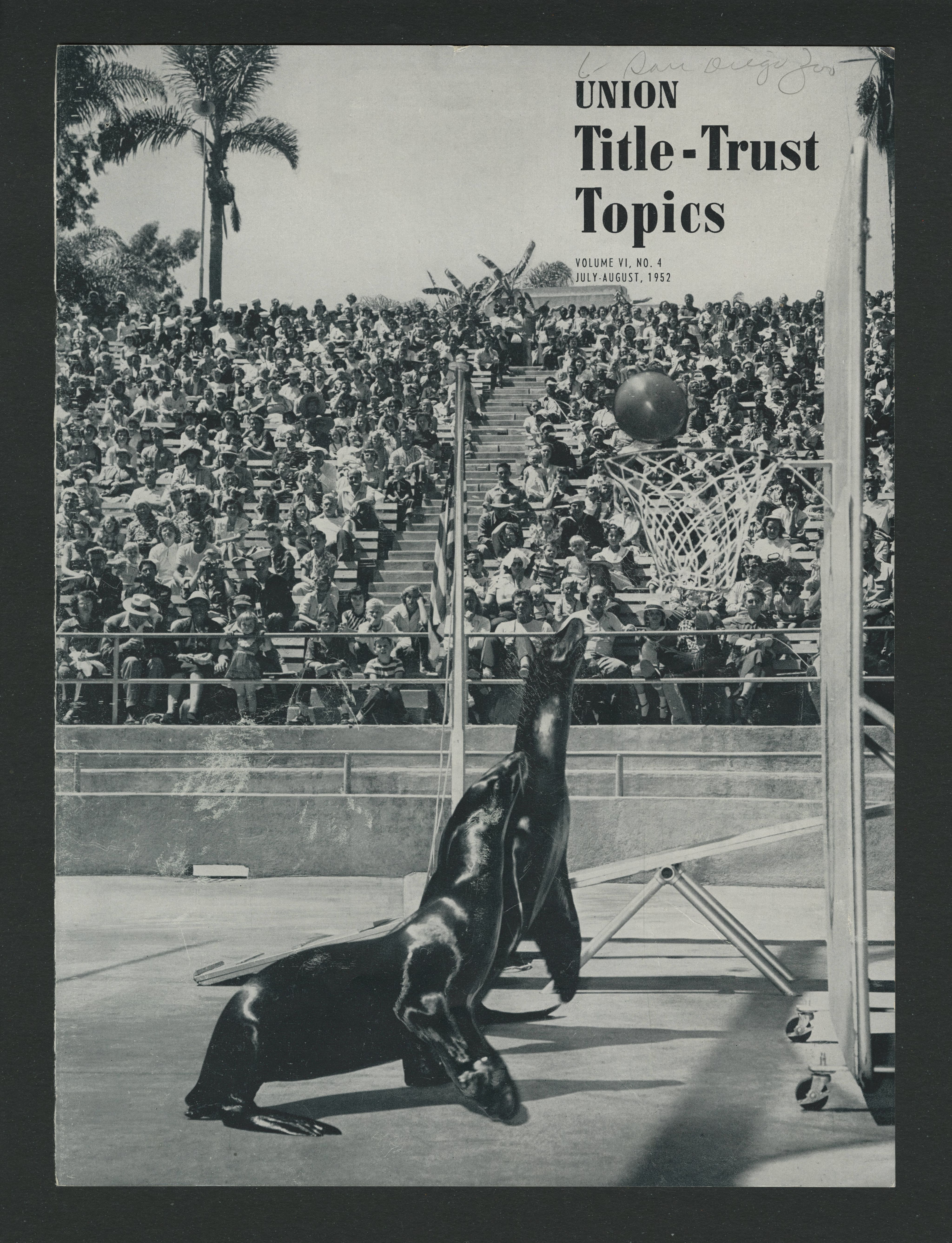 Cover of a newsletter featuring two seals performing at an amphitheater in the San Diego Zoo.